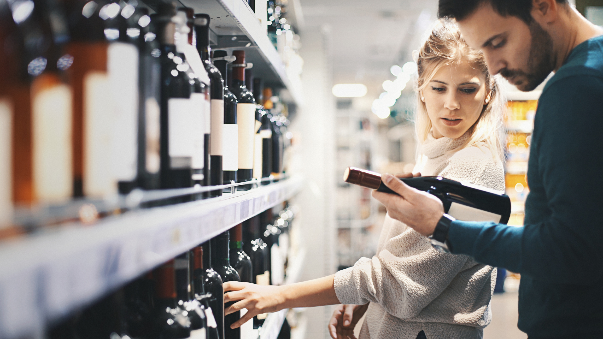 A couple shopping for wine